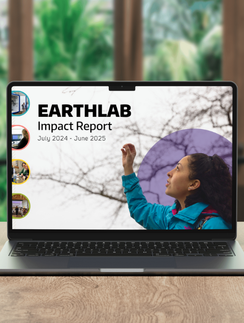 Mockup of the EarthLab FY25 Impact Report cover on a laptop screen