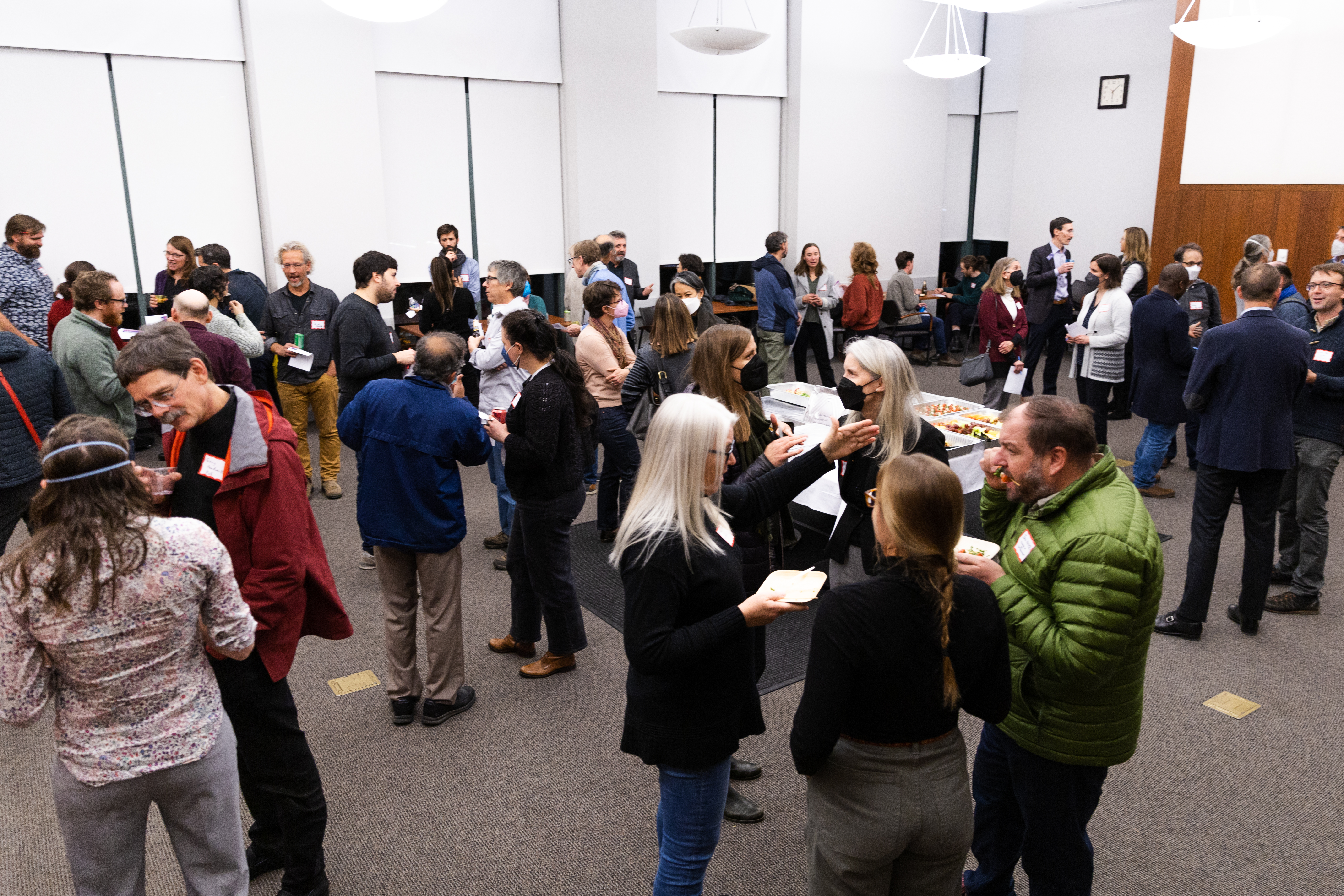 Over 100 climate researchers networking after lightning talks